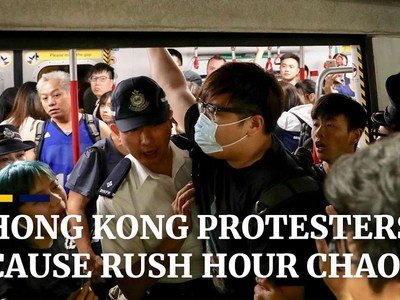 Extradition bill protesters cause rush hour chaos in Hong Kong by blocking main MTR rail line