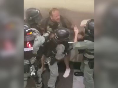 HK Police confront a foreign man