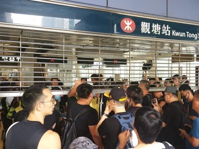 Hongkongers confront MTR staff over closure of train services before protest