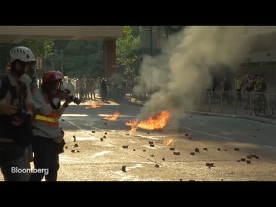 Hong Kong Protesters Attack Police Officer