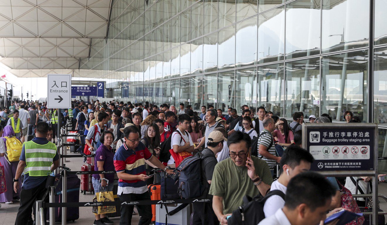 Pre-emptive police measures allow Hong Kong airport to run smoothly, with little sign of chaos threatened by protesters