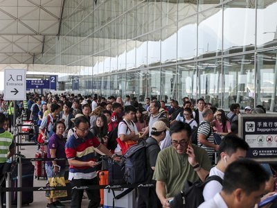 Pre-emptive police measures allow Hong Kong airport to run smoothly, with little sign of chaos threatened by protesters
