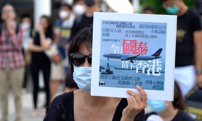 Protest-hit Cathay cuts flights, freezes hiring and spending