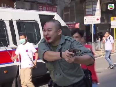Police under massive attack shoots at Hong Kong protesters