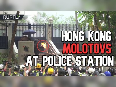 Hong Kong protesters throw Molotovs at police station