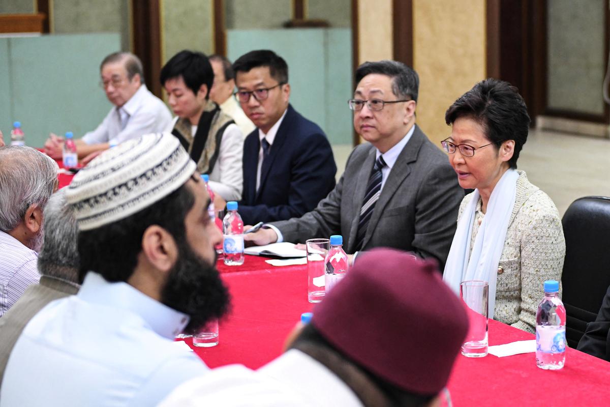 Hong Kong leader apologizes for mosque incident after day of violence