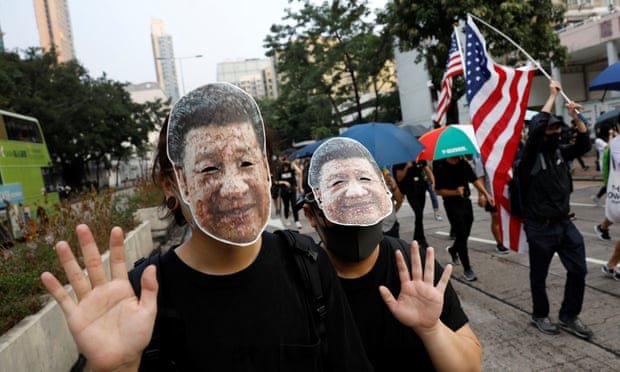 Hong Kong protesters defy ban on masks as they clash with police