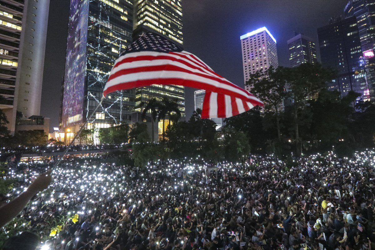Hong Kong protesters take over park and roads to support US democracy act