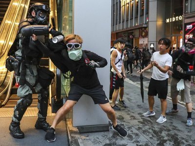 At least 77  anti-mask law arrests amid Hong Kong’s ‘escalating vandalism’