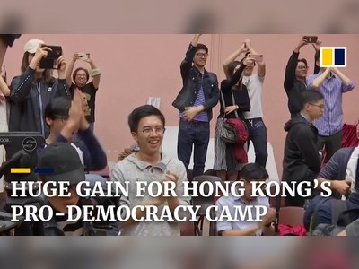 Hong Kong votes overwhelmingly for pro-democracy camp with record turnout in local elections
