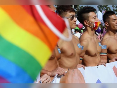 Thousands show up for pride parade on LGBT rights in Hong Kong, as some wear masks and chant anti-government protest slogans