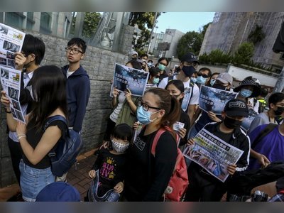 Parents and children in march against health hazards of tear gas used by Hong Kong police amid months-long unrest
