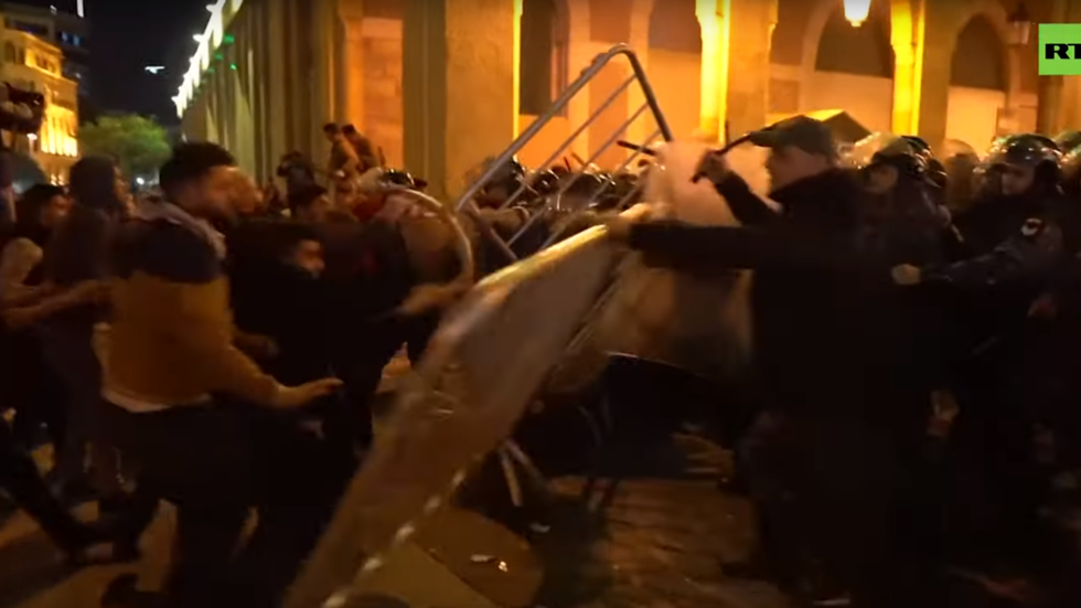 Dozens injured in street battles between protesters and police on the streets of Beirut