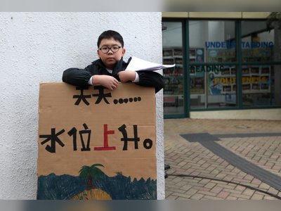 Hong Kong boy stages solo Friday climate protests at school gates, inspired by Greta Thunberg