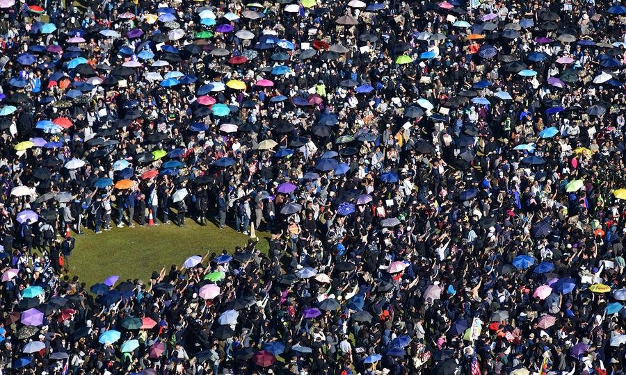 Hong Kongers mark half year of protests with huge rally