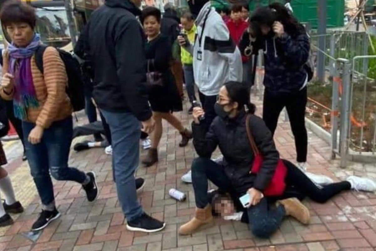 Photograph of Hong Kong policewoman sitting on 14-year-old who was resisting arrest goes viral