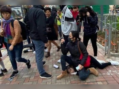 Photograph of Hong Kong policewoman sitting on 14-year-old who was resisting arrest goes viral