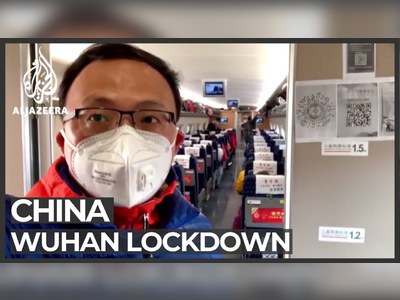 Thousands leave Wuhan as travel ban finally lifted