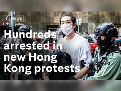 Hong Kong police fire pepper spray at protesters as they make hundreds of arrests