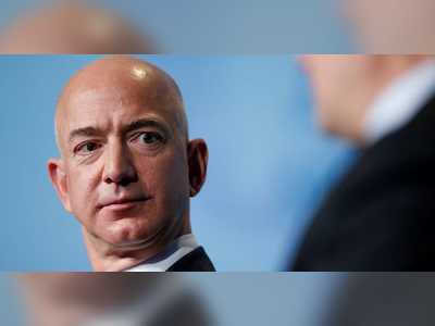 Protesters set up a guillotine outside Jeff Bezos' mansion and demanded higher wages for Amazon workers after the CEO's net worth surpassed $200 billion
