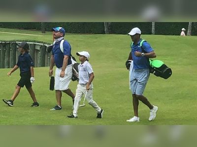 Woods upstaged by son who cruises to win at junior tournament with dad as caddy