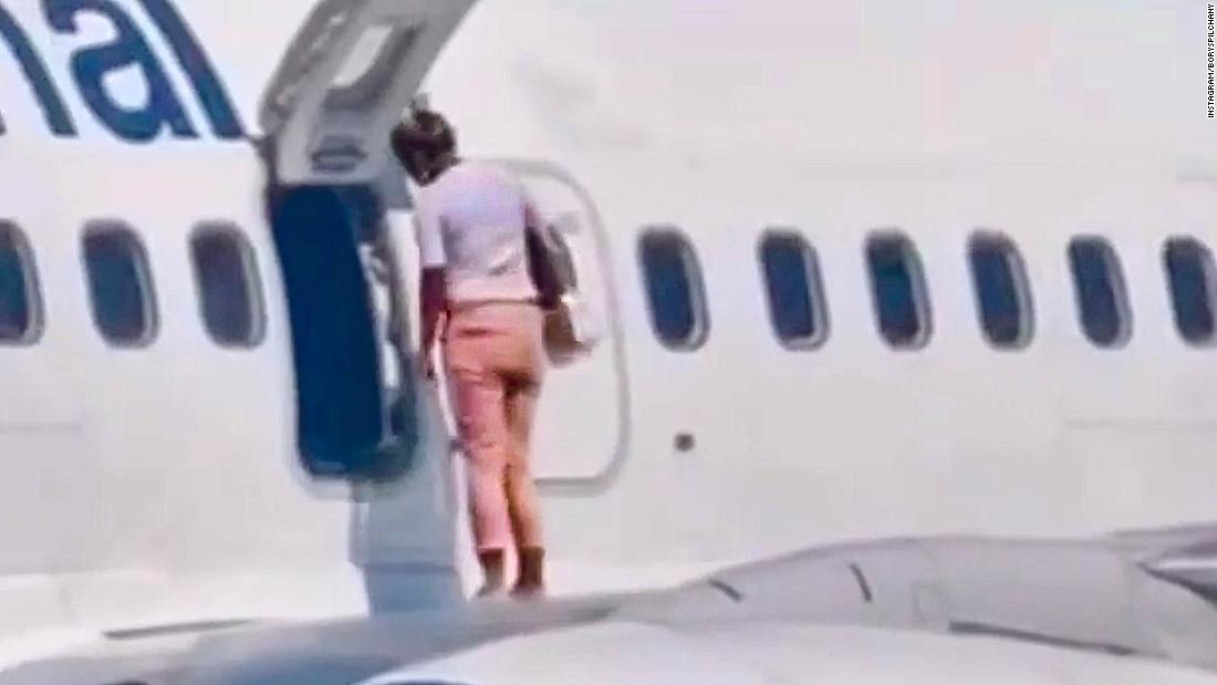The shocking moment a passenger took a walk on an airplane wing