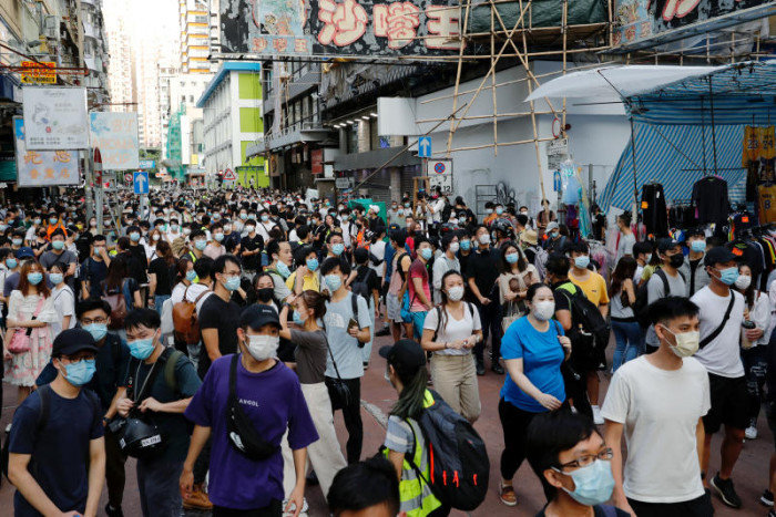 Hong Kong police swoop on postponed poll protests