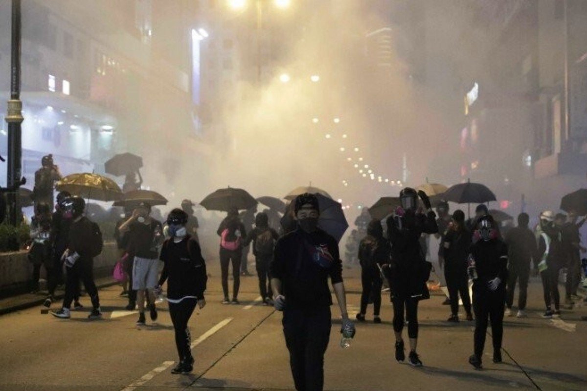 Ambulanceman arrested over attack on tourist at Hong Kong protest
