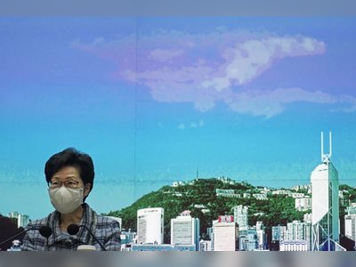 Hong Kong leader seeking Beijing's help for ailing economy