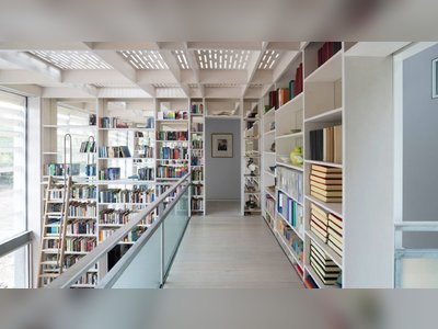 A former agricultural shed is transformed as a modern home with double height library
