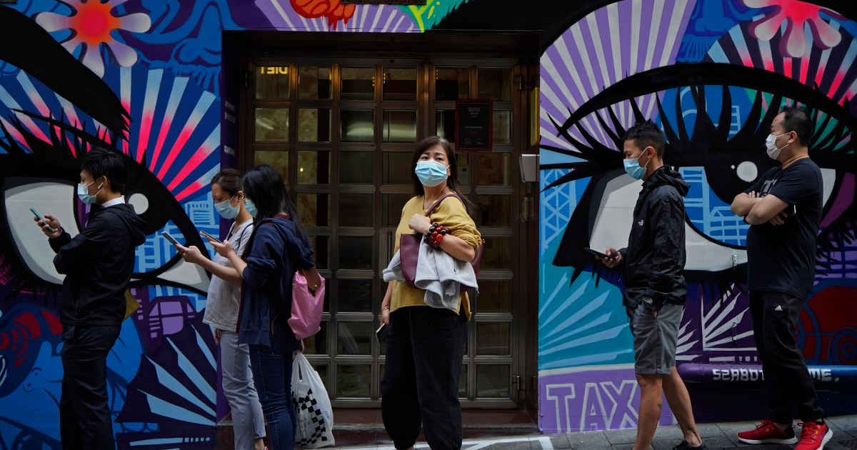 Hong Kong tightens COVID-19 curbs as dance club cluster grows