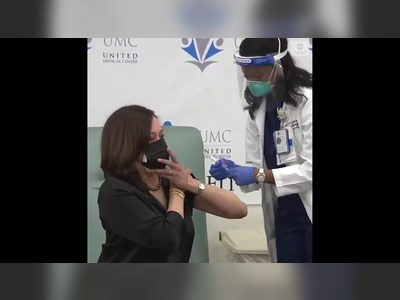 Vice President-elect Kamala Harris receives her first dose of the Moderna vaccine at United Medical Center in Washington, D.C.