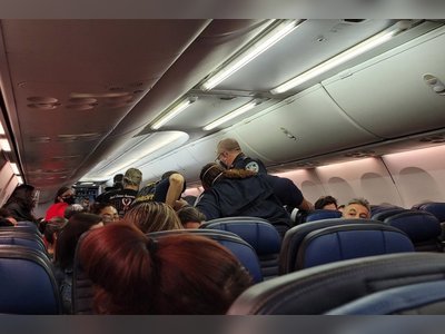 United passenger who died after collapsing on crowded plane had COVID-19