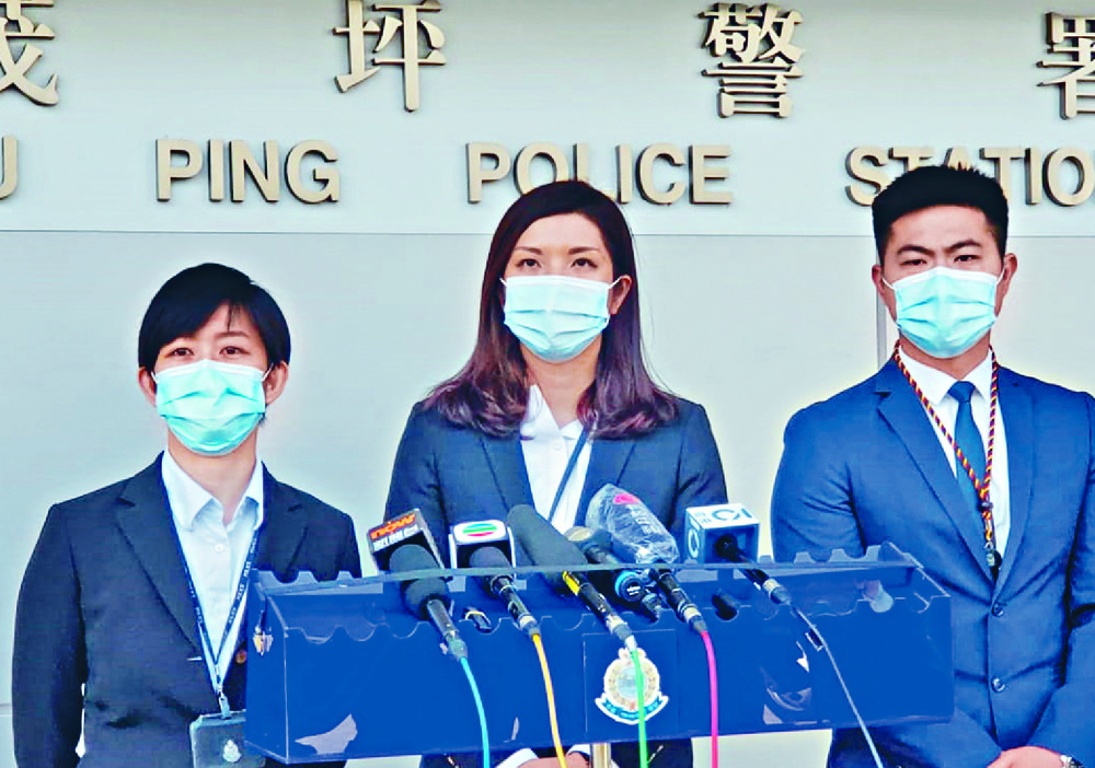Tam Lok-yan, far left, said the victim was duped into giving the suspect HK$2.6 million in cash and four luxury watches. sing tao