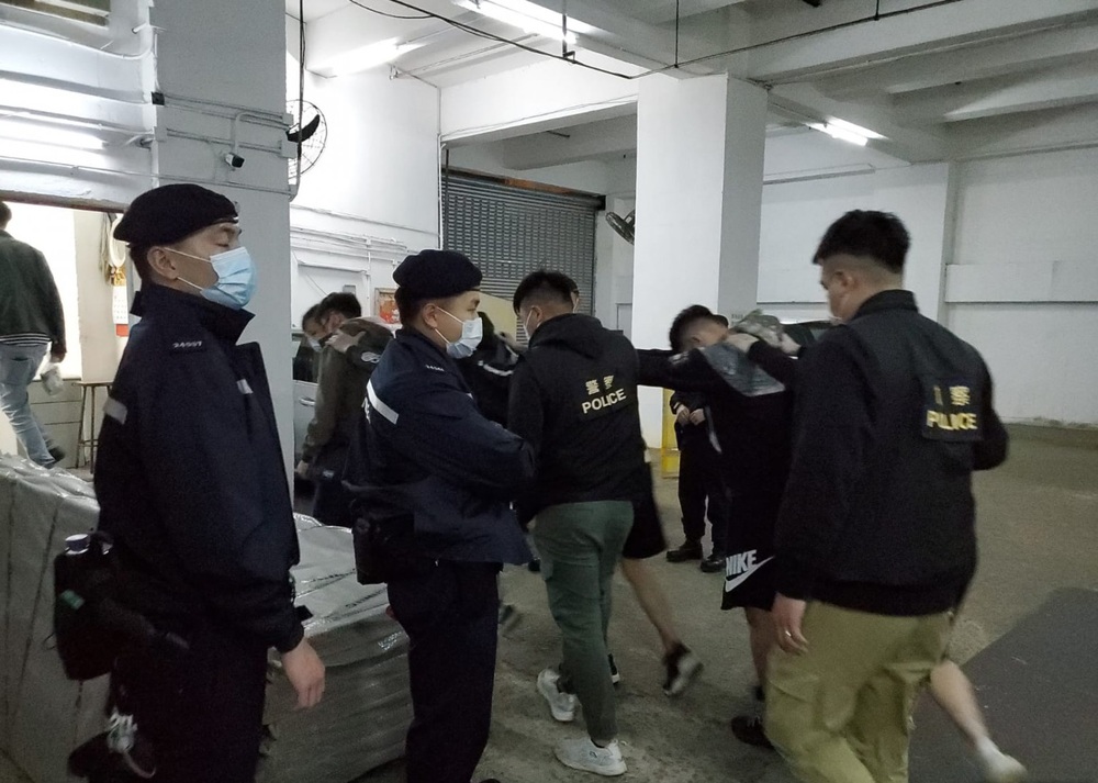 Police arrest 19 people during raid on illegal gambling den and unlicensed bar