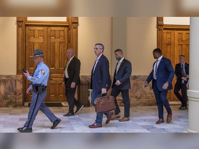 Georgia secretary of state’s office evacuated as armed protesters gather