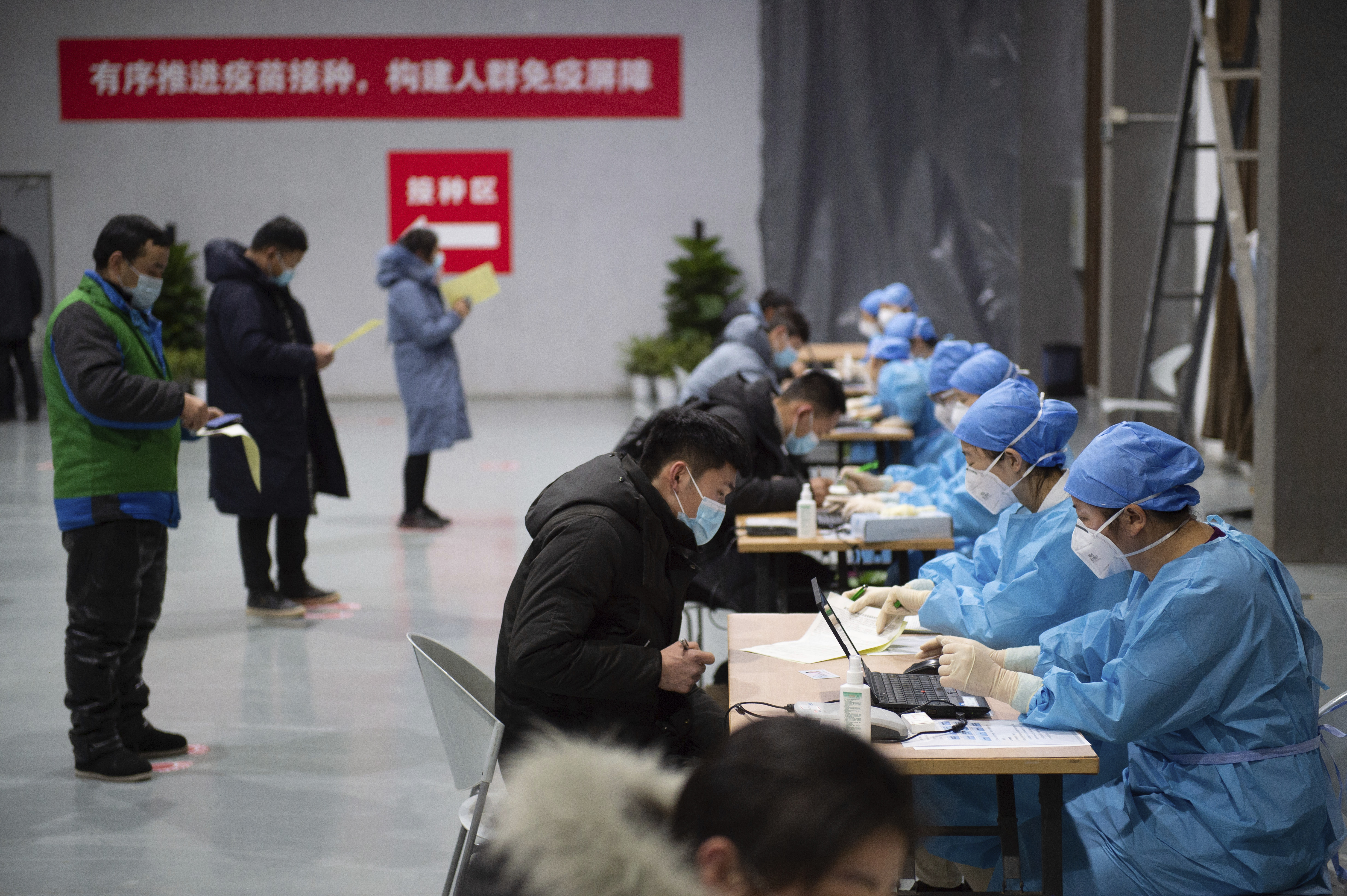 Chinese city of 11 million enters lockdown after coronavirus surge