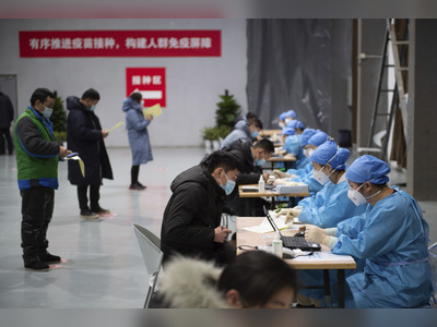 Chinese city of 11 million enters lockdown after coronavirus surge