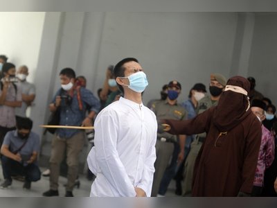 Two Indonesian men publicly caned 80 times each for gay sex