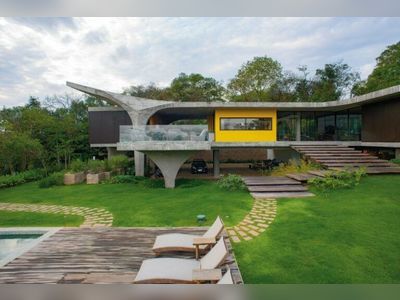 A Concrete House In Brazil Floats Above A Lovely Garden