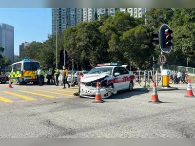 Two hurt as police car, private vehicle collide at Hong Kong intersection