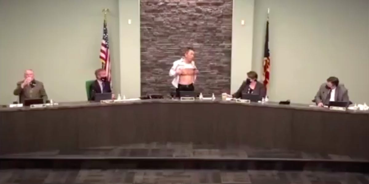 'Is this patriot enough?' Asian-American Army veteran protests racism by displaying wounds from military service during a town hall meeting