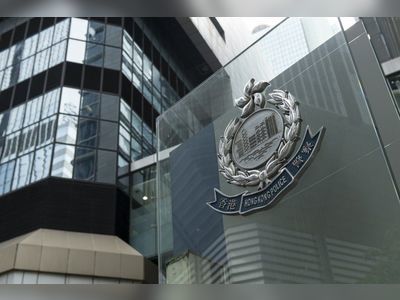 Hong Kong police officer among 65 arrested in raid on illegal gambling den