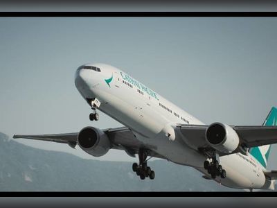 Cathay Pacific gets ready to take off from Dubai