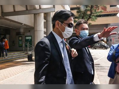 Hong Kong police officer charged with fraud barred from leaving city