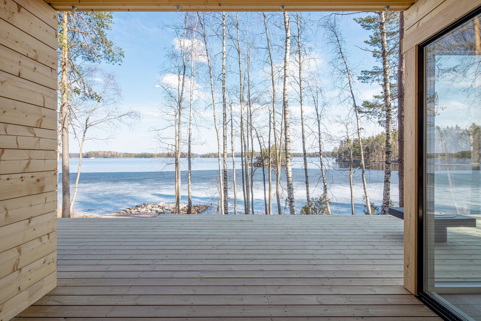 A Log Cabin Kit Sauna Is Built Lakeside for a Post-Steam Plunge in Finland