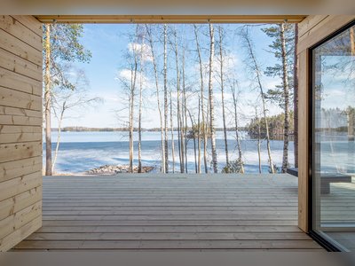 A Log Cabin Kit Sauna Is Built Lakeside for a Post-Steam Plunge in Finland