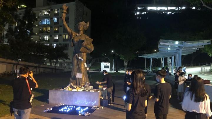 Flowers and candle lights at CUHK to remember Tiananmen Square amid vigil ban