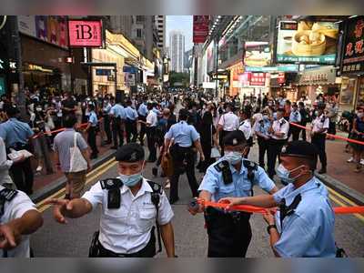 Police raise purple flag warning of national security law breach in Causeway Bay and Mong Kok