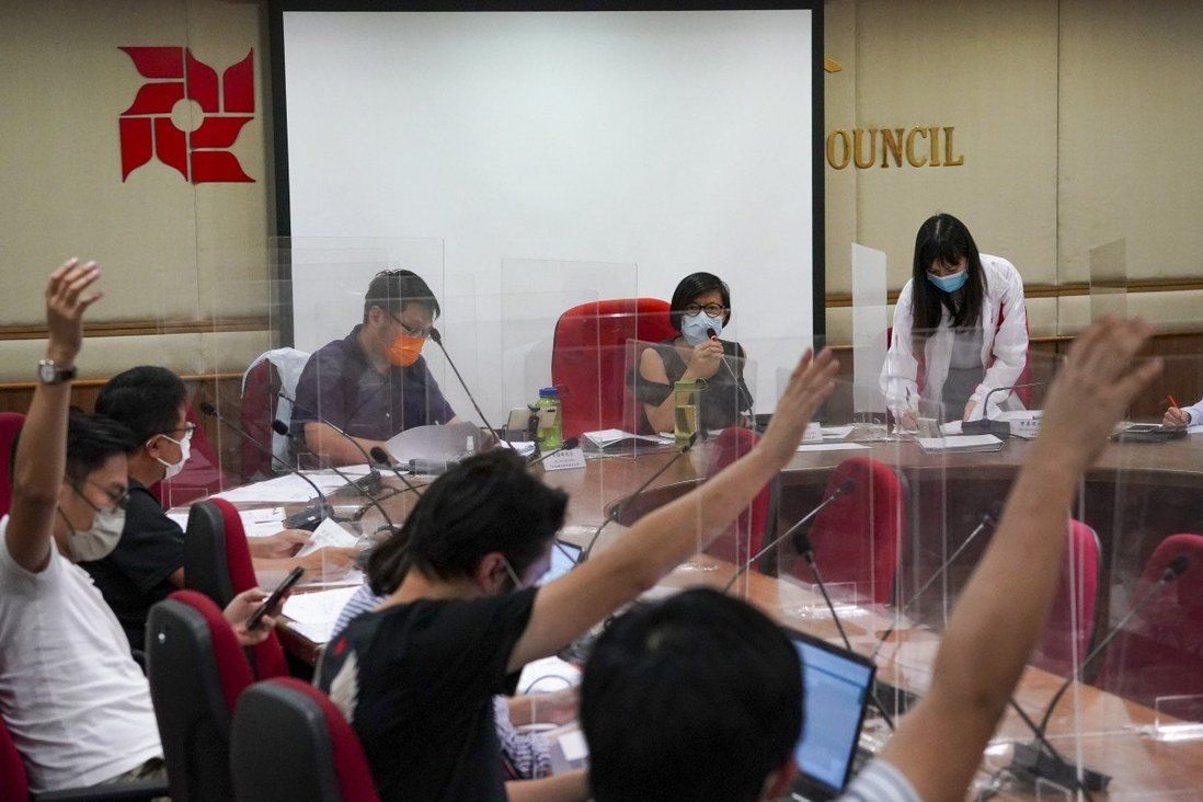 More than 70 Hong Kong opposition councillors quit ahead of coming cull